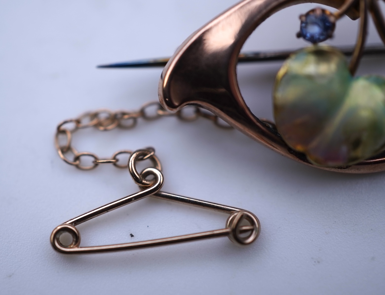 An attractive Art Nouveau enamel, sapphire and seed pearl brooch, early 20th century